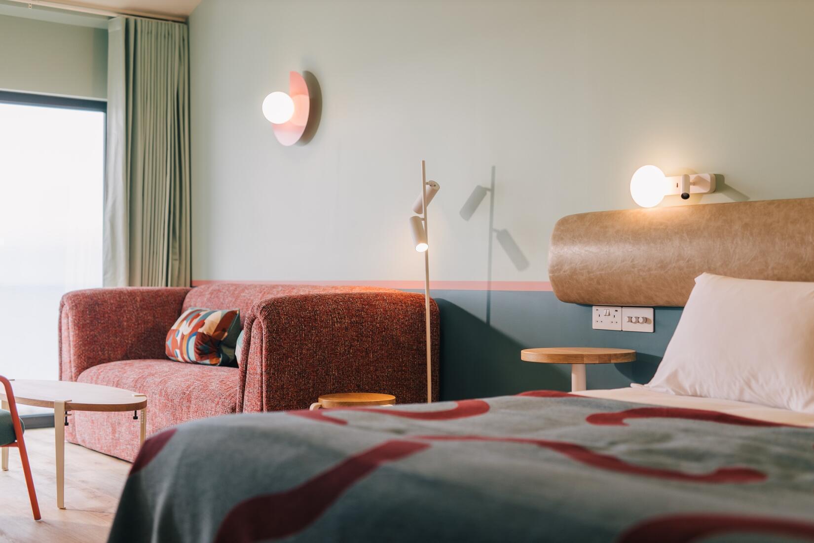 Studio bed and living area looking out to sea at SeaSpace