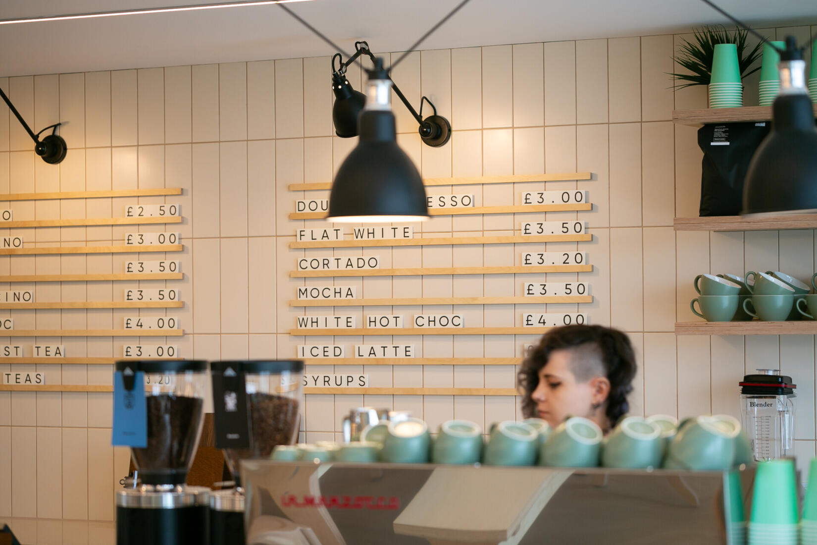 Team member making coffee at SeaSpace cafe