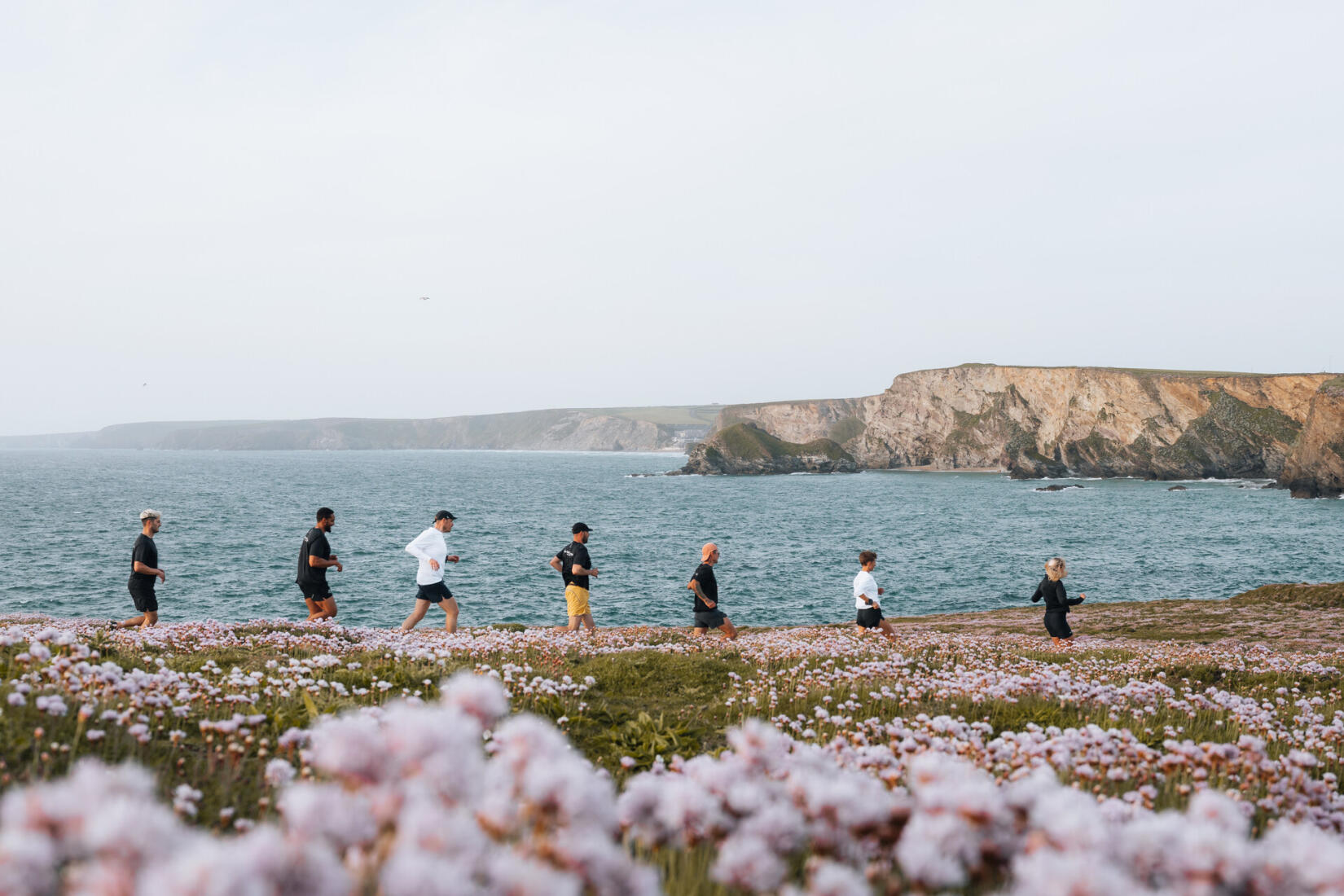 Cubs running club running along the coast path towards Watergate Bay