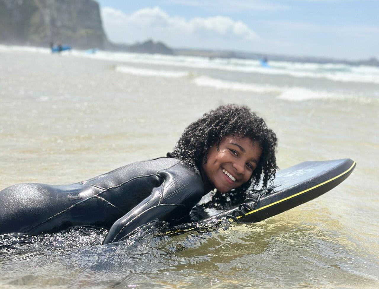 Child bodyboarding at Porth Beach Newquay