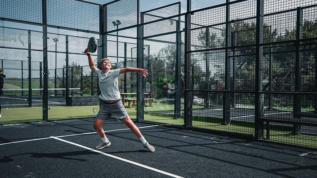 Child playing padel
