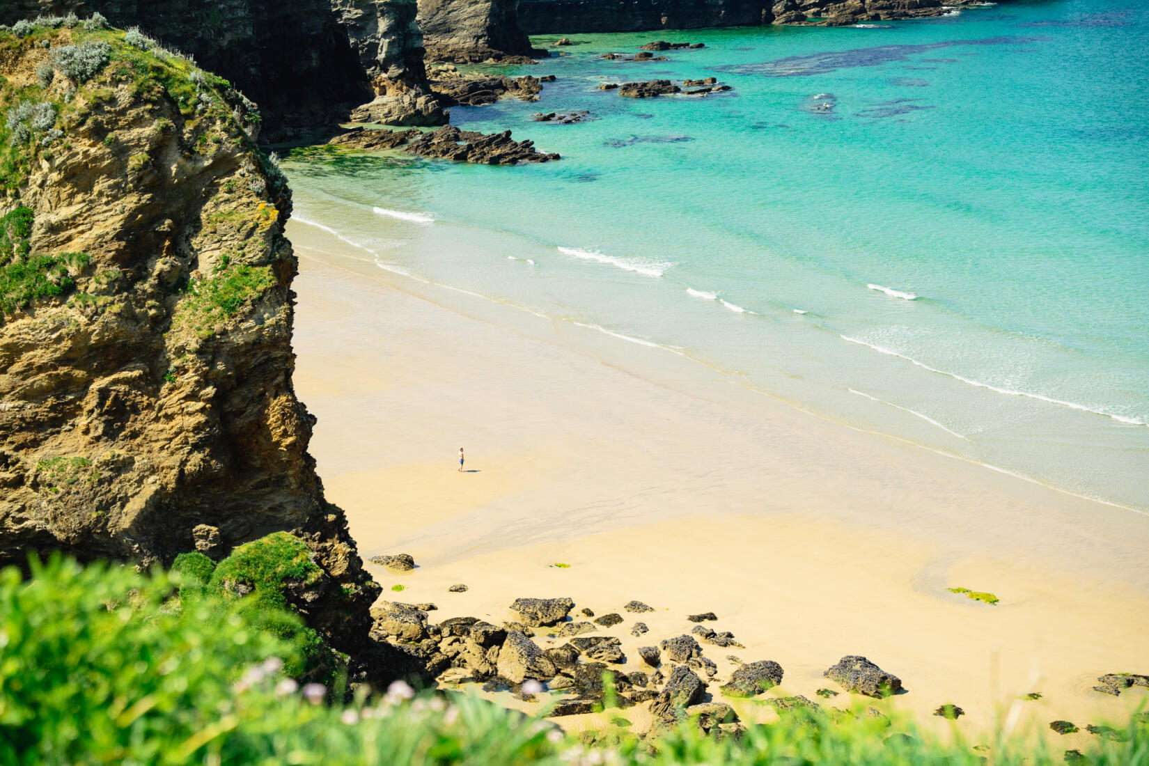 Looking down from the cliffs of Porth in Newquay Cornwall