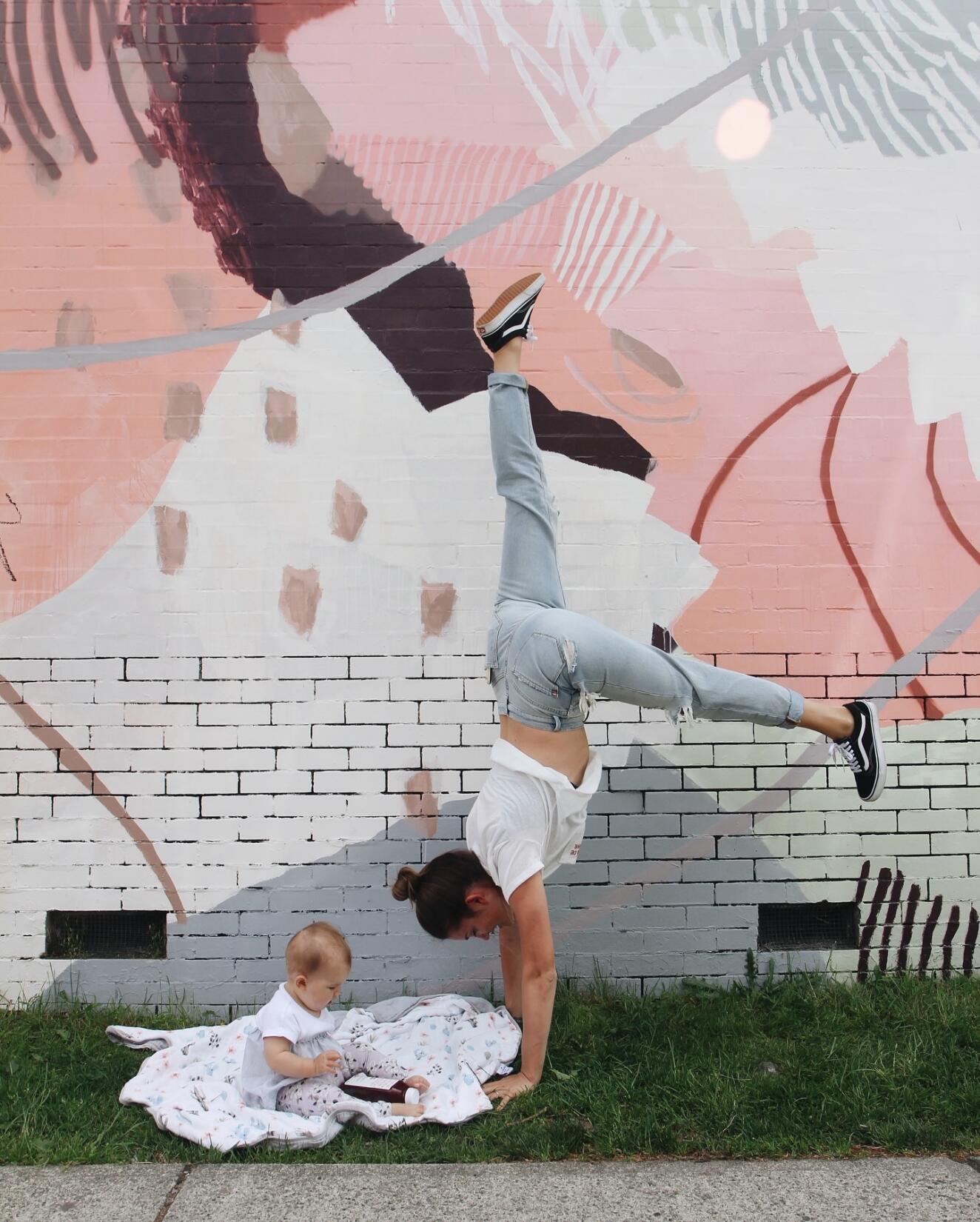 Woman doing yoga with her baby