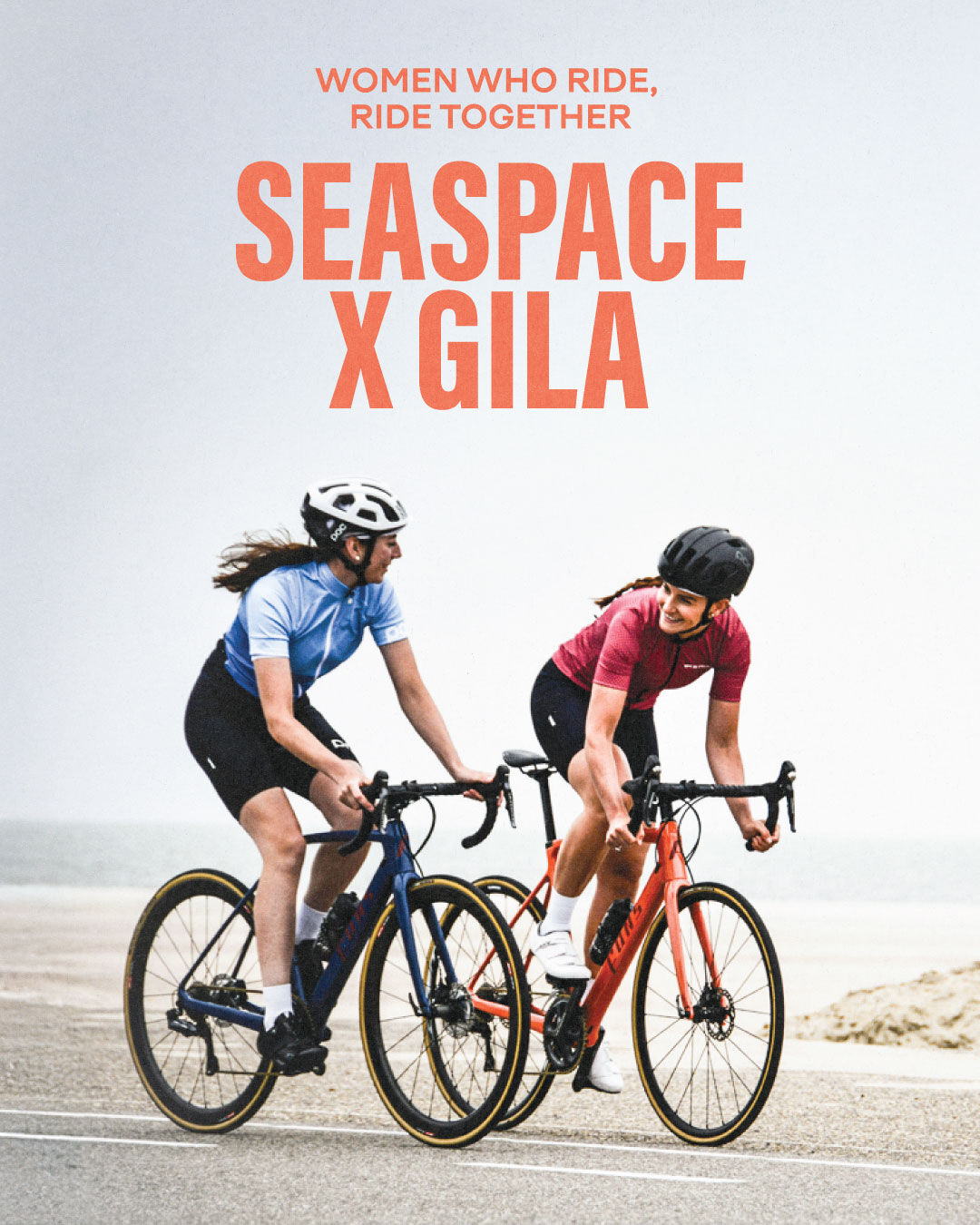 Two women cycling together