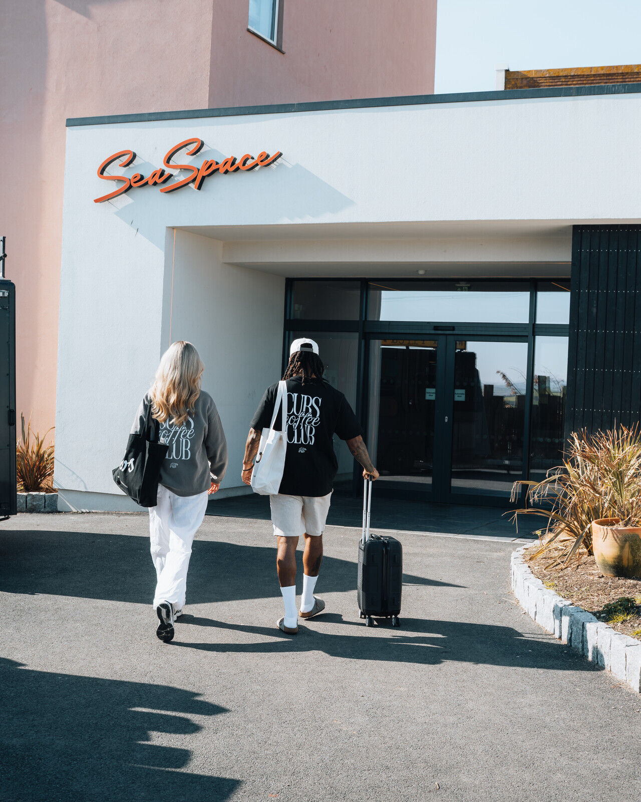 Two people walking towards the entrance at SeaSpace