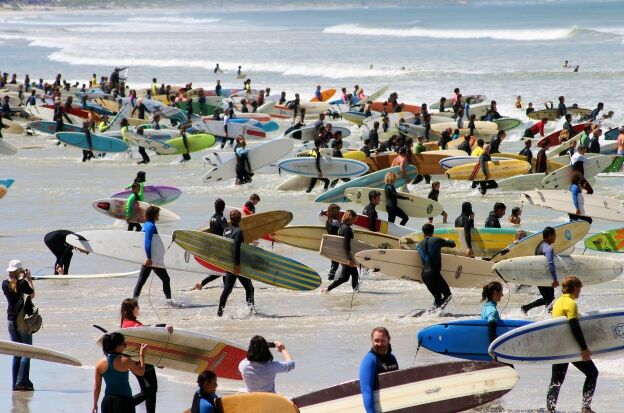 Large amount of surfers entering the sea